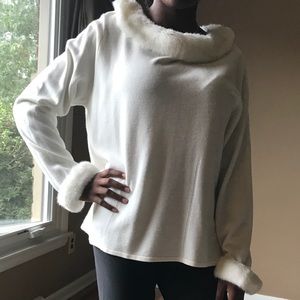 Sweater with detachable collar and cuffs.